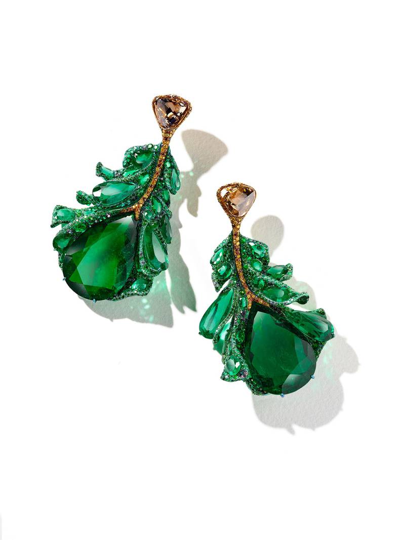 Green Plumule Earrings: The matching earrings feature two large Colombian emeralds, as well as two briolette-cut brown diamonds.