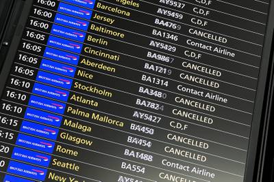 Cancelled flights are displayed on the departures board at Heathrow Airport. AP