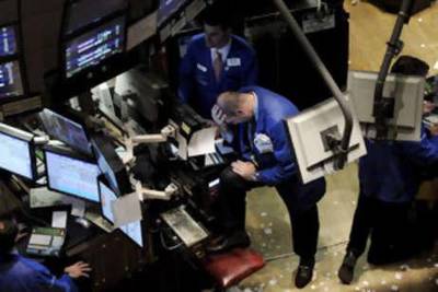 Traders work on the floor of the New York Stock Exchange at the end of the trading day in New York, New York, on Nov 6 2008.