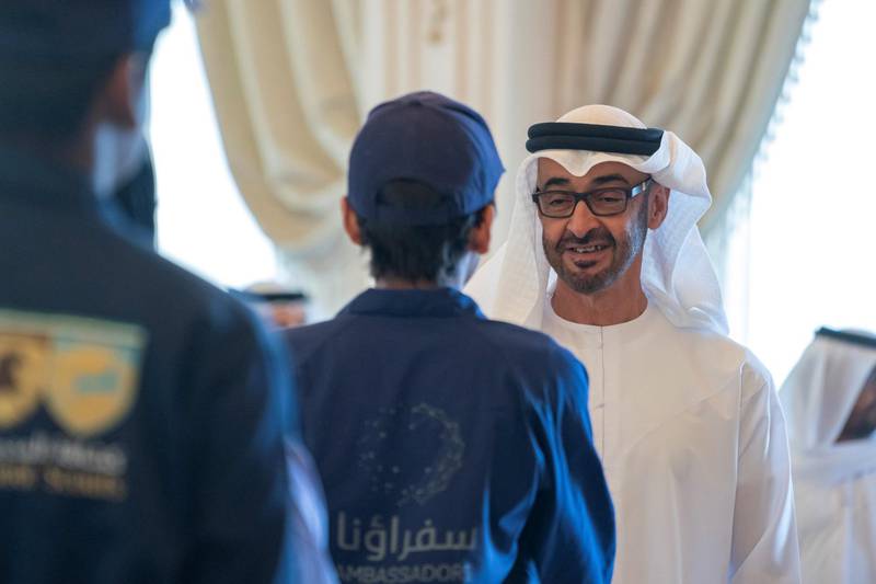 ABU DHABI, UNITED ARAB EMIRATES - August 06, 2019: HH Sheikh Mohamed bin Zayed Al Nahyan, Crown Prince of Abu Dhabi and Deputy Supreme Commander of the UAE Armed Forces (R), greets a member of the Ministry of Education 'Giving Ambassadors', during a Sea Palace barza.

( Mohamed Al Hammadi / Ministry of Presidential Affairs )
---