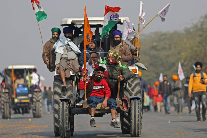 Farmers protest during a tractor rally near the Singhu border crossing in Delhi, India. Bloomberg