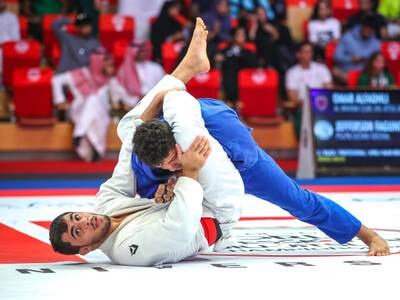 Omar Alfadli of the UAE, white, grapples Jefferson Faguindes for the bronze during the 15th Abu Dhabi World Professional Jiu-Jitsu Championship. Victor Besa / The National