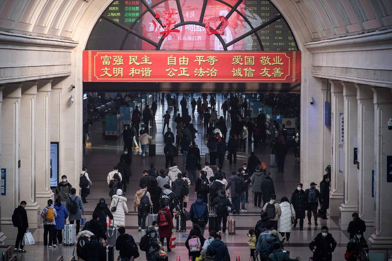 Passengers arrive at Hankou railway station in Wuhan. AFP