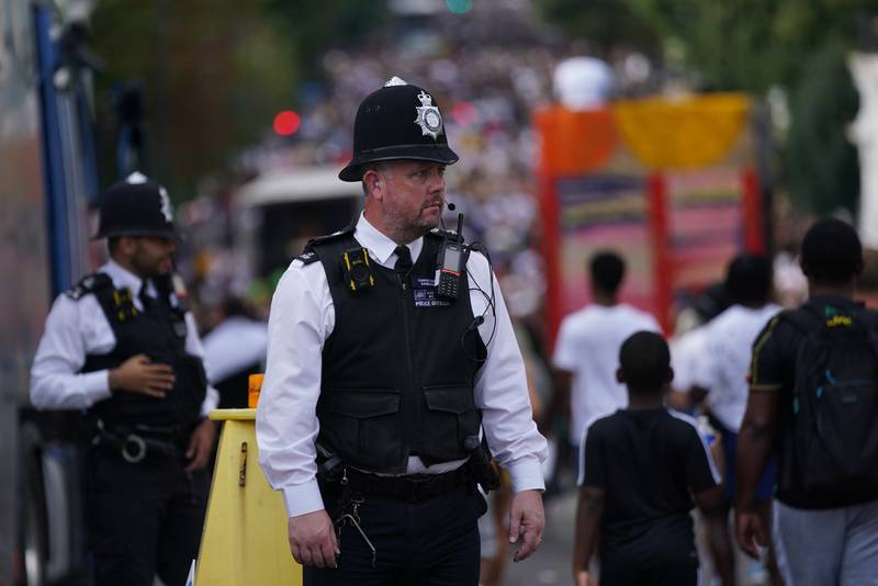 Police keep an eye on carnival-goers. PA