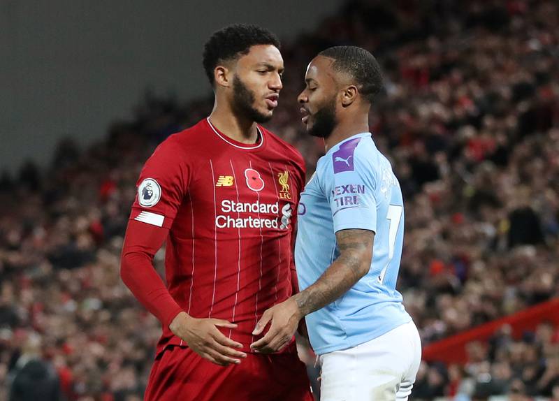 Soccer Football - Premier League - Liverpool v Manchester City - Anfield, Liverpool, Britain - November 10, 2019. Picture taken on November 10, 2019   Liverpool's Joe Gomez and Manchester City's Raheem Sterling clash    Action Images via Reuters/Carl Recine    EDITORIAL USE ONLY. No use with unauthorized audio, video, data, fixture lists, club/league logos or "live" services. Online in-match use limited to 75 images, no video emulation. No use in betting, games or single club/league/player publications.  Please contact your account representative for further details.