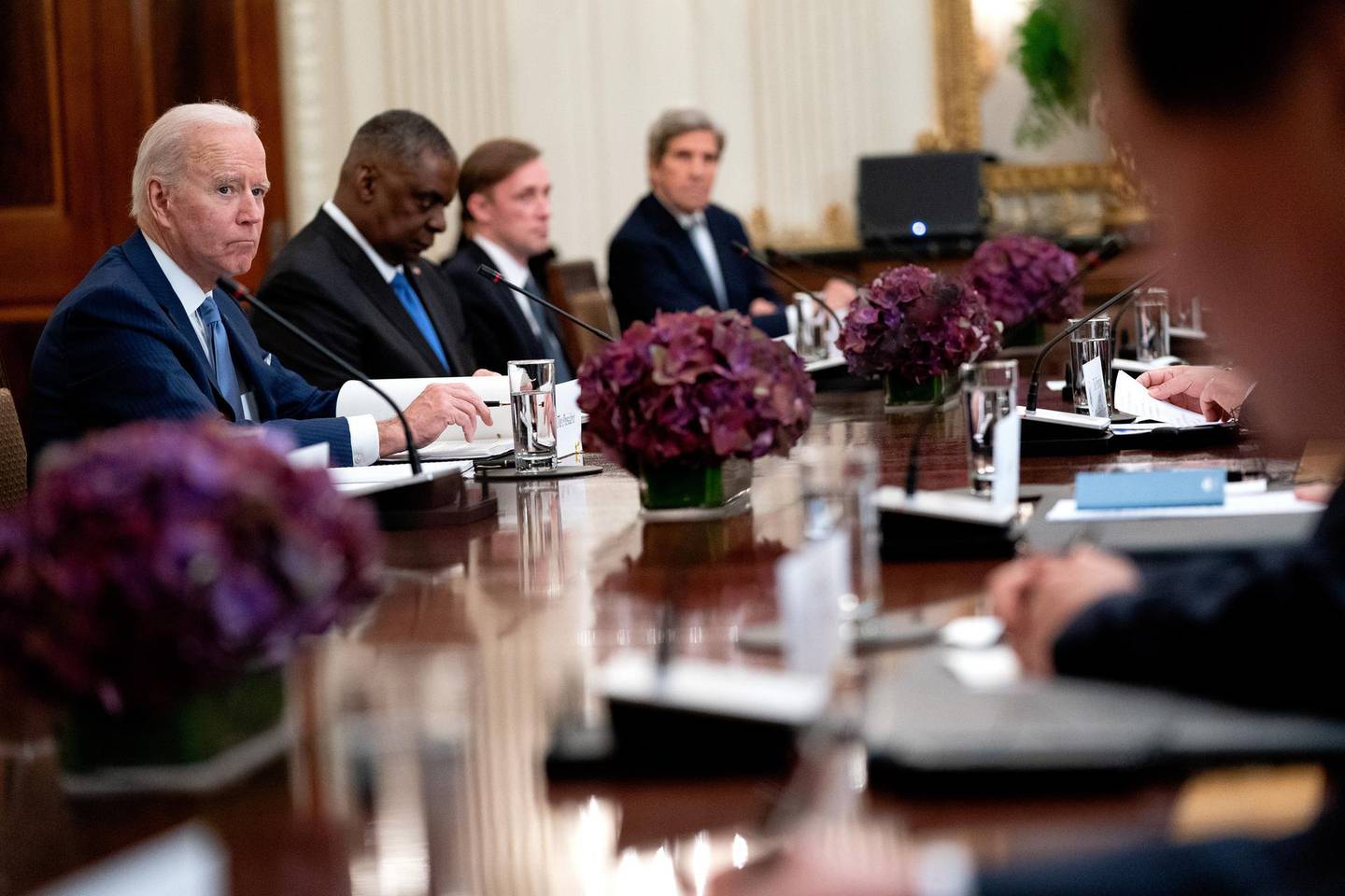 epa09218985 US President Joe Biden (L) listens during a bilateral meeting with South Korean President Moon Jae-in in the State Dining Room of the White House in Washington, DC, USA, 21 May 2021. Biden welcomed Moon for talks expected to span North Korea's nuclear program, a global semiconductor shortage and climate change.  EPA/Stefani Reynolds / POOL