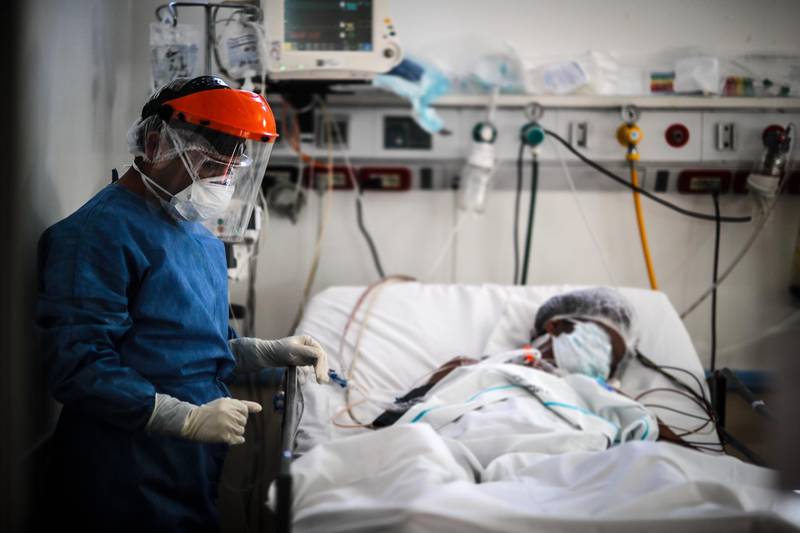 A doctor checks on a patient at El Cruce de Florencio Varela Hospital in Buenos Aires, Argentina. EPA