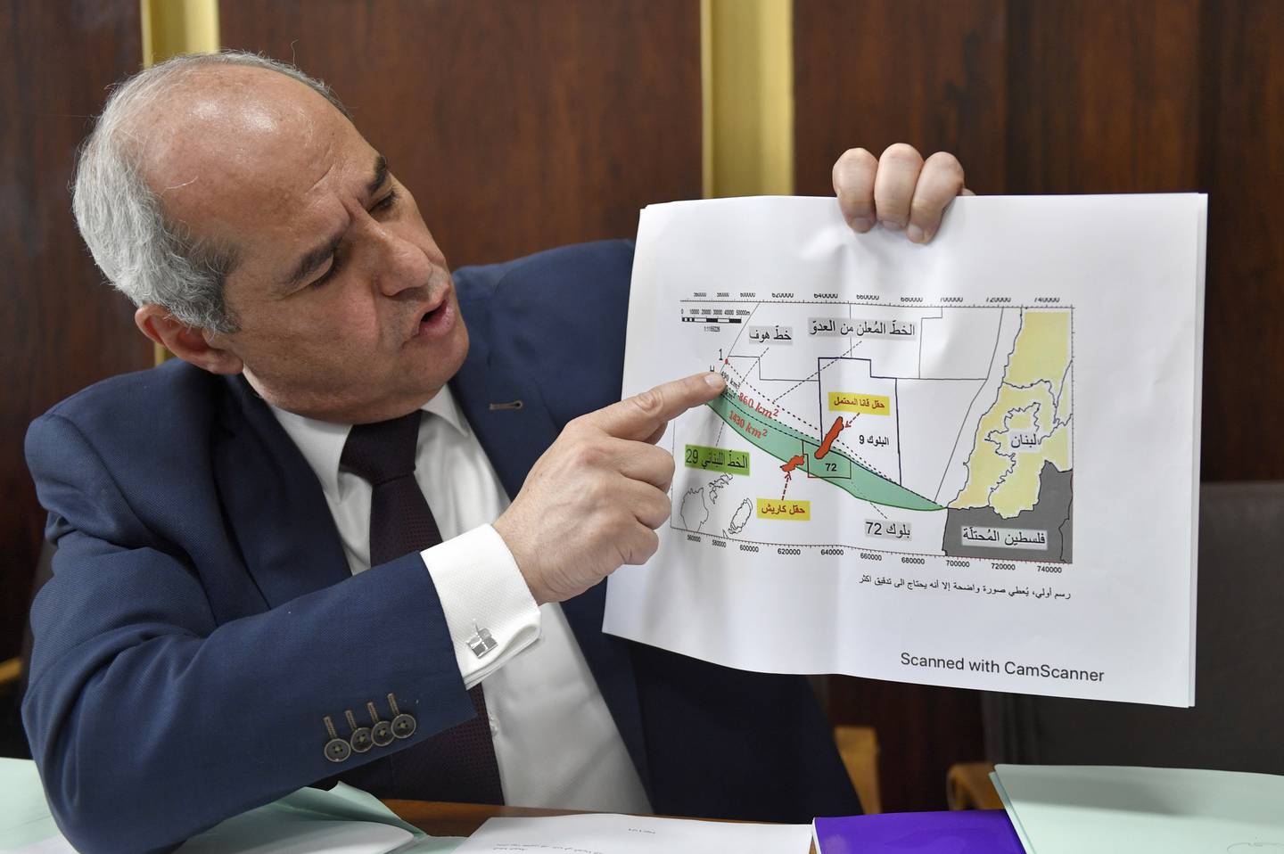 Lebanese MP Melhem Khalaf holds up a map of the Line 29 maritime demarcation zone in Beirut. Mr Khalaf claimed Israel was drilling for oil in some fields, including those adjacent to the Lebanese border. EPA