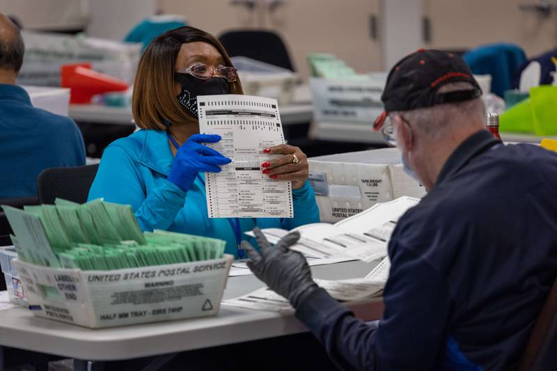 Election workers sort ballots at the Maricopa County Tabulation and Election Centre. AFP