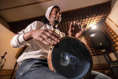 "Tabla" drum instructor Mostafa Bakkar gives a lesson at his studio in Egypt's capital Cairo on March 28, 2022.  - Many Egyptians associate the tabla drum with belly dancers and seedy nightclubs but, despite its image problem, percussionists are giving the ancient instrument a new lease of life.  (Photo by Khaled DESOUKI  /  AFP)