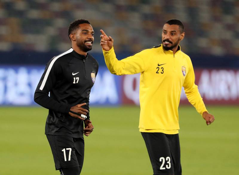 Abu Dhabi, United Arab Emirates - December 21, 2018: Mohamed Ahmed (R) and Khalid Essa of Al Ain train ahead of the Fifa Club World Cup final. Friday the 21st of December 2018 at the Zayed Sports City Stadium, Abu Dhabi. Chris Whiteoak / The National