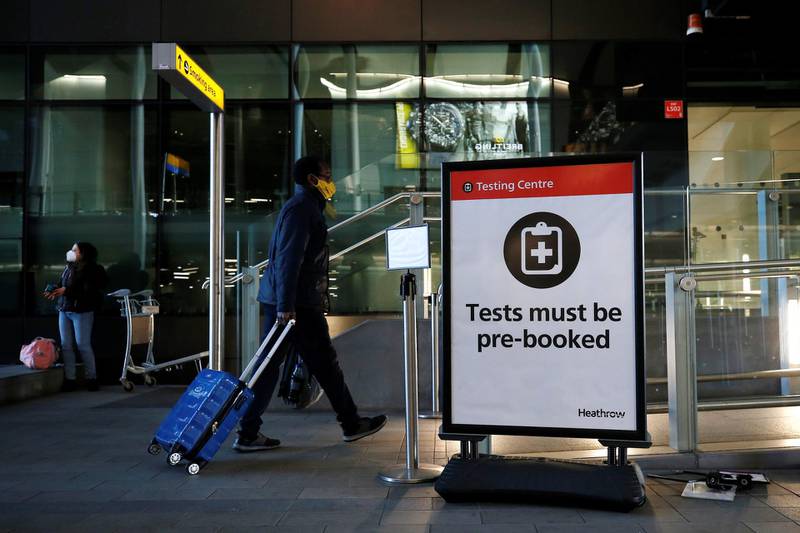 LONDON, ENGLAND - JANUARY 17: A traveler enters a testing centre at Heathrow Airport on January 17, 2021 in London, England. Tomorrow morning the UK will close its so-called "travel corridors" with countries from which arriving travelers were exempt from quarantine requirements. People flying into the UK will now be required to quarantine for 10 days unless they test negative for covid-19 after five days, or unless they qualify for a business-travel exemption. (Photo by Hollie Adams/Getty Images)