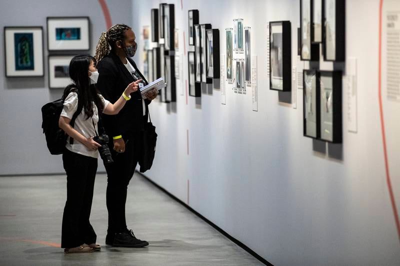 Visitors look at the drawings and preliminary researches for animated characters in animation movies. EPA