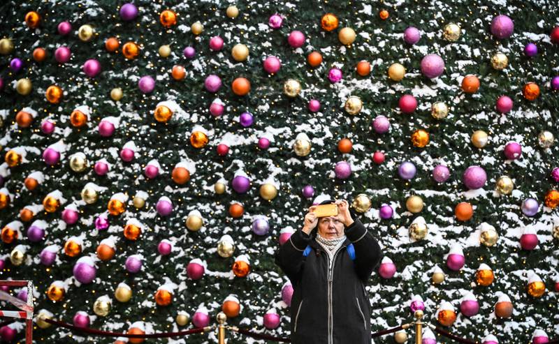 Time for a festive selfie in front of the Christmas and New Year decorations in central Moscow. AFP