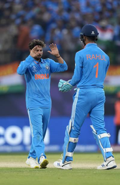 Kuldeep Yadav and KL Rahul celebrate the wicket of New Zealand's captain Tom Latham. AP 