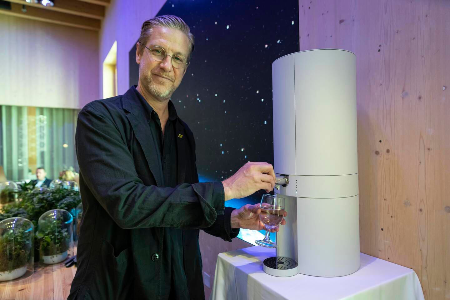 Martin Renck, co-founder and creative director at Wayout International, demonstrates his company's smart tap system at Expo 2020 which provides safe drinking water from treated sources, including sea water. Photo: Antonie Robertson / The National