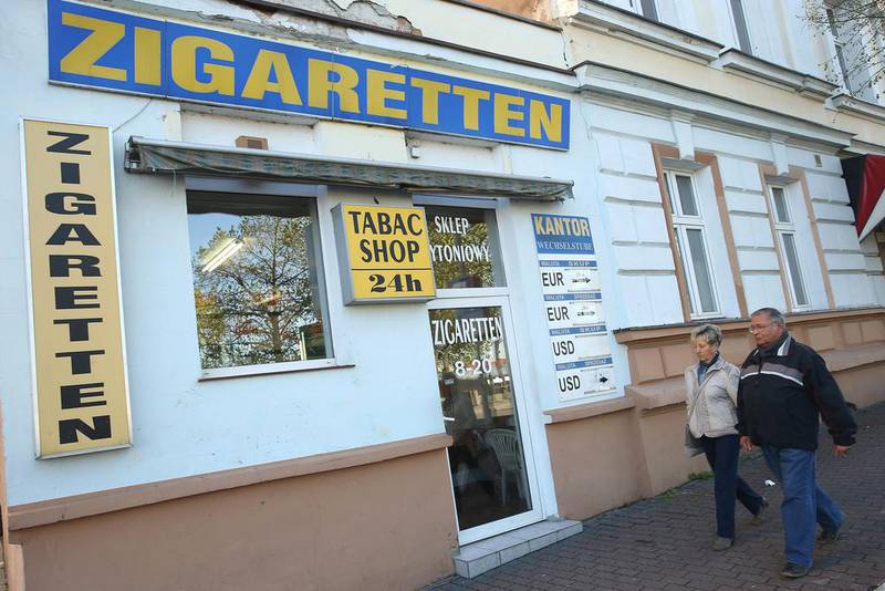 People walk past a shop that seels cigarettes that are cheaper than in Germany near the German-Polish border. Sean Gallup / Getty Images