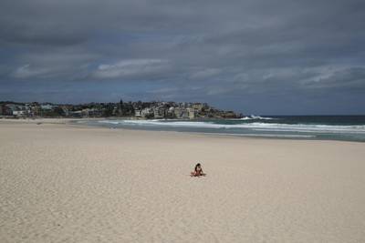 A single sunbather remains following the closure of Bondi Beach after thousands of peopled flocked there in recent days, defying social distancing orders to prevent the spread of the coronavirus disease (COVID-19), in Sydney, Australia. REUTERS