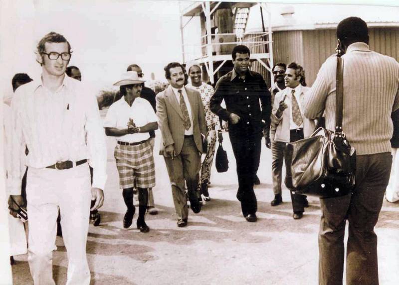 In 1974, Abdullah Kaddas Al Romaithi, seen in the plaid shorts and cowboy hat, gave a tour of the greenhouses to boxer Muhammad Ali when the heavyweight visited the region. The Saadiyat greenhouses project ended in 1975. Courtesy Ali Kaddas Al Romaithi
