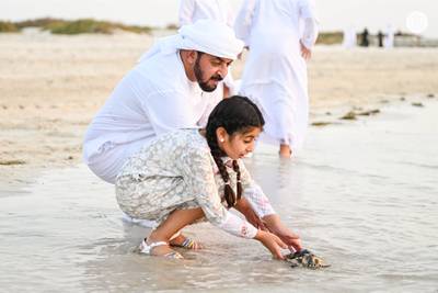 Sheikh Hamdan bin Zayed, chairman of the board of directors of Environment Agency Abu Dhabi, took part in a sea turtle release event at Saadiyat Island with his young family. All pictures by Abu Dhabi Media Office