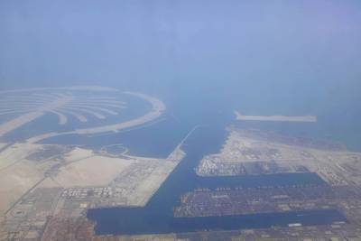 An aerial photo shows the Palm Jebel Ali's proximity to Jebel Ali Port, the 11th largest in the world. Razan Alzayani / The National
