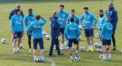 Former player Mike Bueskens, centre, leads the training of Schalke. The club fired coach Christian Gross on Sunday after two months in charge along with four senior club staff in a desperate bid to avoid Bundesliga relegation. AP