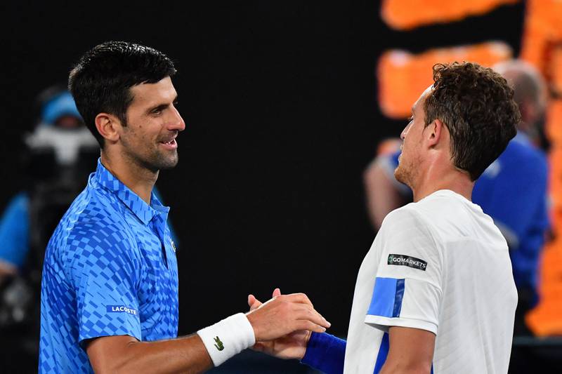 Novak Djokovic shakes hands with Roberto Carballes Baena after the match. AFP