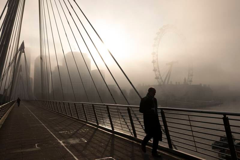 London had cold and foggy start to Tuesday, with people making their way across the Jubilee Bridge. Getty
