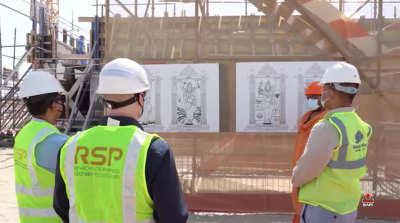 Officials scan etchings of deities that will carved on the pillars of the Hindu temple being constructed in Abu Dhabi.