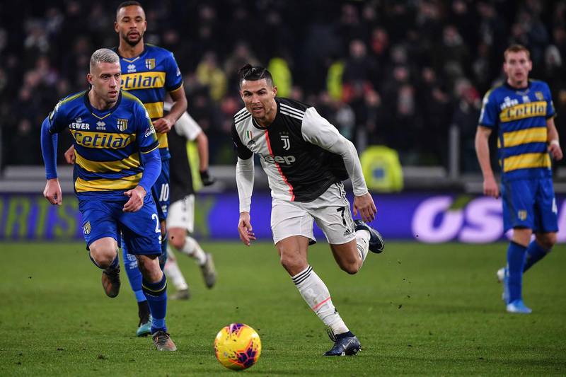 Cristiano Ronaldo runs at the Parma defence. AFP