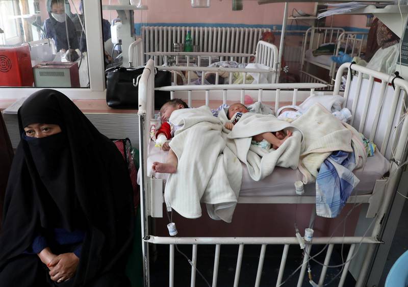 Newborn children who lost their mothers during the attack lie on a bed at a hospital, in Kabul, Afghanistan. REUTERS