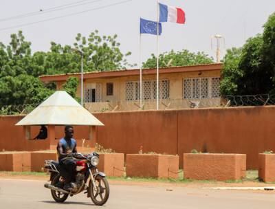 Motorists drive past the French embassy in Niamey, Niger. EPA