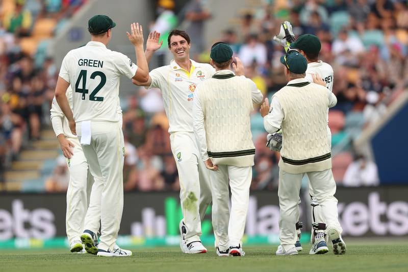 Australia bowler Pat Cummins celebrates after taking the wicket of England's Dawid Malan for 25. Getty