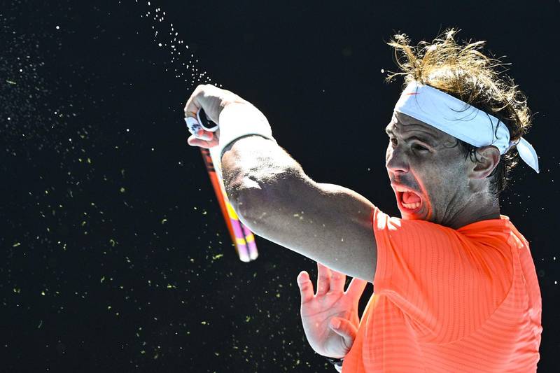 epa08997853 Rafael Nadal of Spain in action during his first Round Men's singles match against Laslo Djere of Serbia on Day 2 of the Australian Open at Melbourne Park in Melbourne, Australia, 09 February 2021.  EPA/DEAN LEWINS AUSTRALIA AND NEW ZEALAND OUT