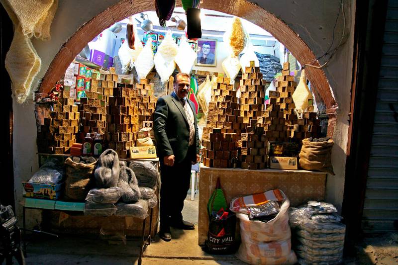Ammar Mouwfaq, 70, stands inside his soap shop in the Old City of Mosul, Iraq. Mouwfaq inherited the business in 1955 and for decades his family have imported olive soap from Aleppo, Syria, a trade that has dated back hundreds of years. That came to a stop when ISIS took control of the area in 2014. AP photo