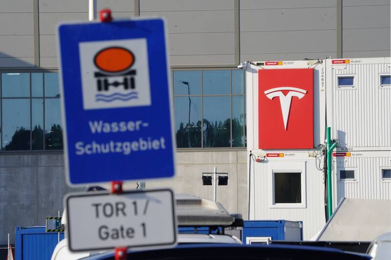 A road sign reading 'water protection area' next to the Tesla logo at the site of the Tesla factory. EPA