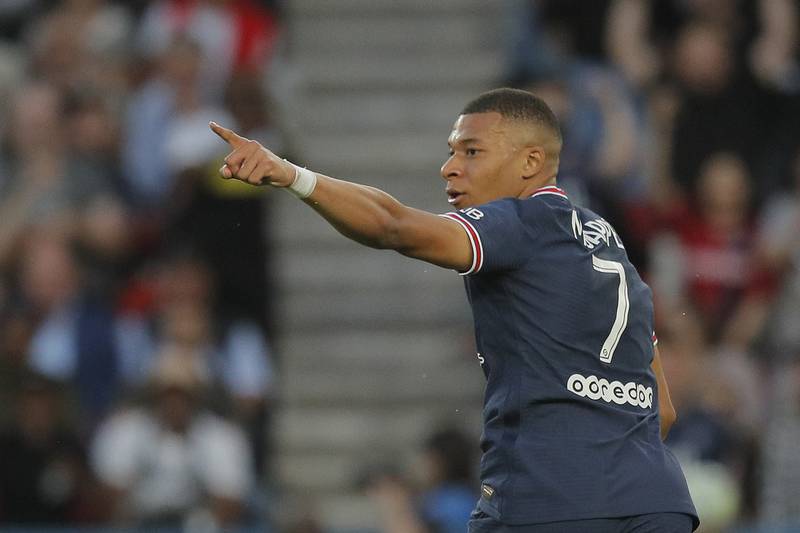 Mbappe celebrates after scoring his first goal. AP