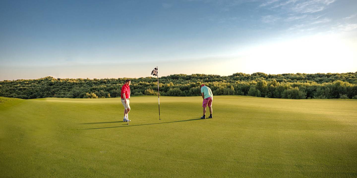 Enjoy a round of golf at Al Zorah Golf Club. Photo: Ajman Tourism