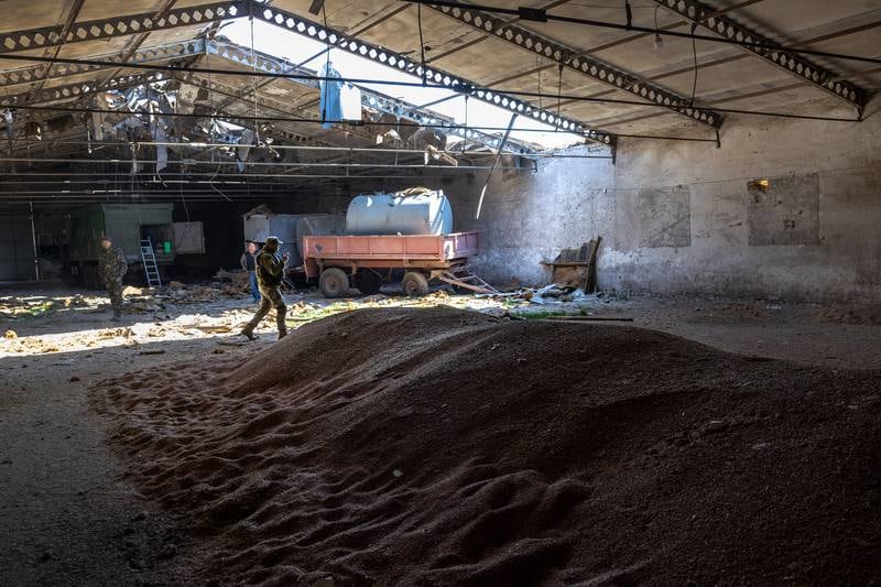 Ukrainian soldiers inspect a grain warehouse damaged in shelling by Russian forces in the Kherson region. Getty