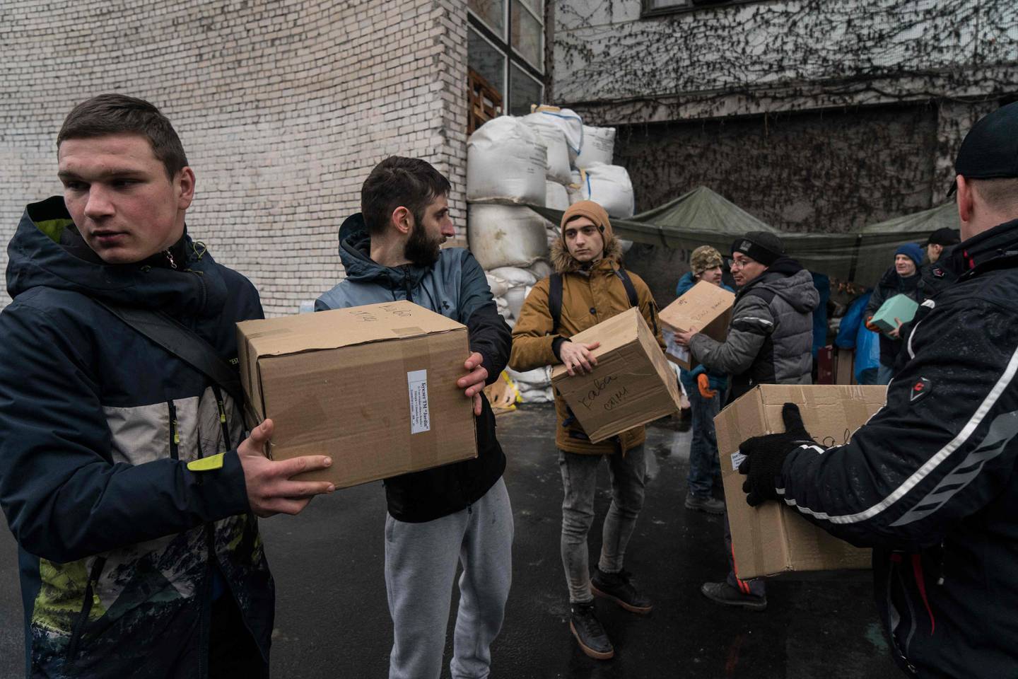 Volunteers unload boxes received from across the country at a charitable fund centre set up to oversee the distribution of humanitarian supplies to those in need, servicemen and the displaced in the Ukrainian city of Dnipro. AFP