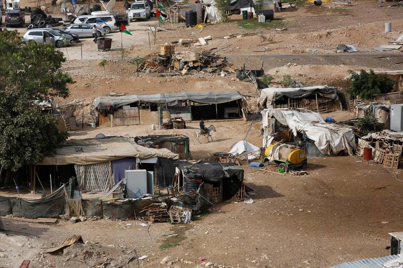 West Bank Bedouin community of Khan al-Ahmar is seen, Sunday, Oct. 21, 2018. Israeli Prime Minister Benjamin Netanyahu said Sunday he has decided to postpone the planned demolition of a West Bank hamlet to allow time for a negotiated solution with its residents, in a move that appeared aimed at staving off the fierce international condemnation such a demolition would likely entail. (AP Photo/Majdi Mohammed)