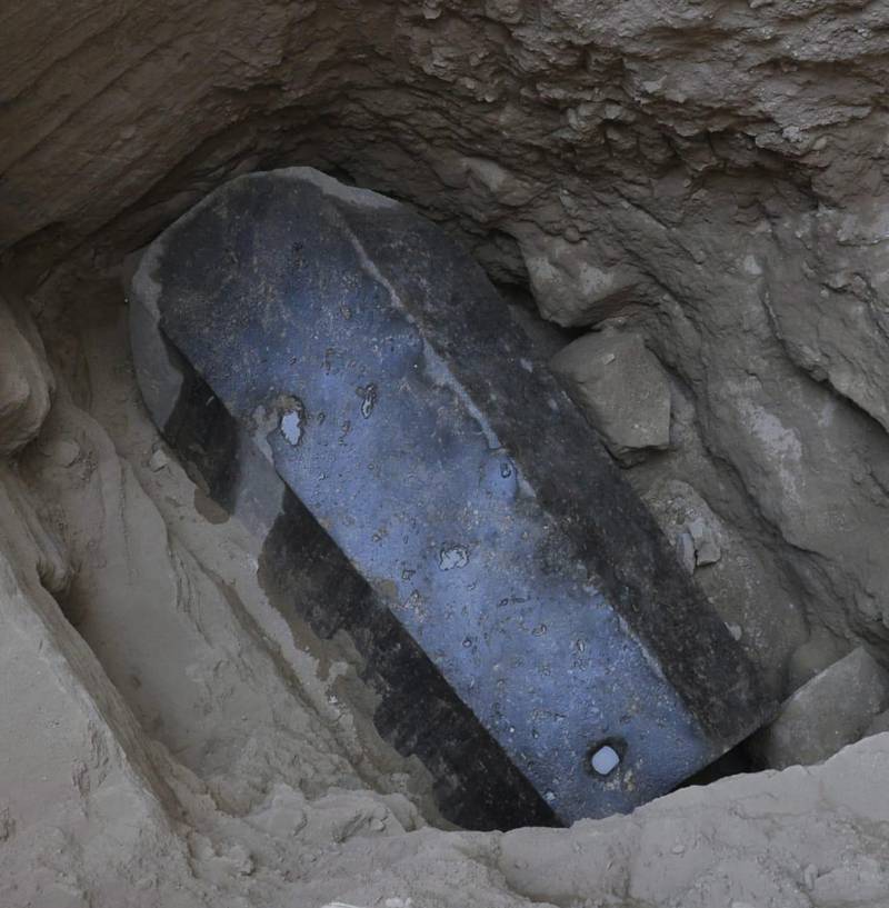 An undated handout photo made available by the Egyptian ministry of Antiquities shows the black granite sarcophagus at the discovered tomb in the Sidi Gaber district of Alexandria. EPA
