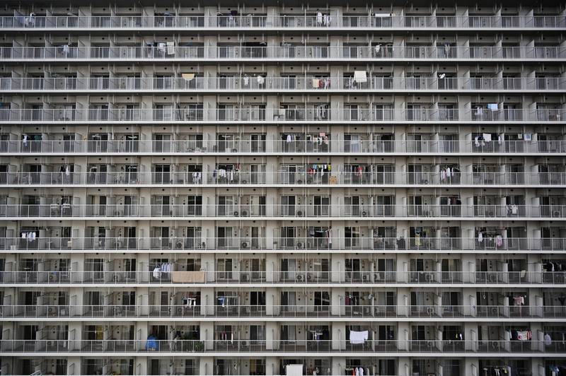 This general view shows a highrise block of flats in Tokyo on April 22, 2019. (Photo by CHARLY TRIBALLEAU / AFP)