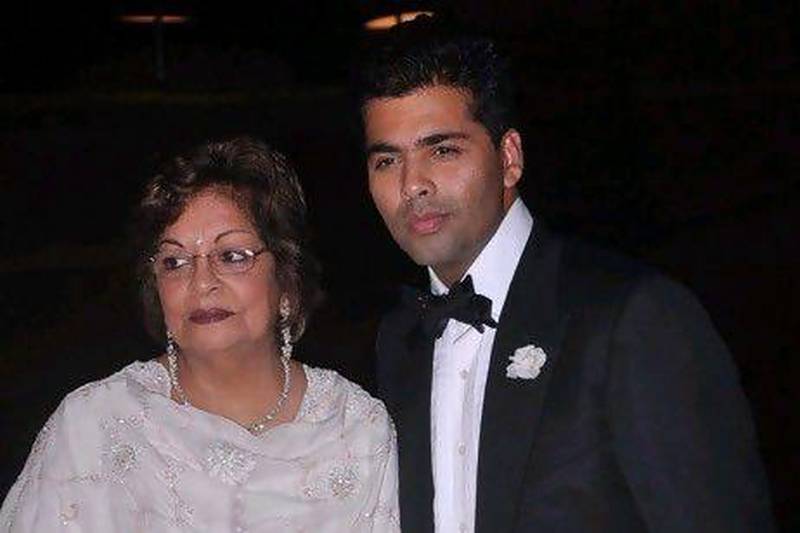 @caption; Karan Johar with his mother at his birthday party in Mumbai. IANS