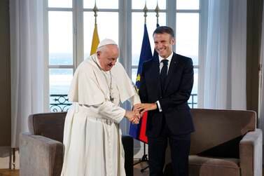French President Emmanuel Macron and Pope Francis meet at the Palais du Pharo, in Marseille, southern France, Saturday, Sept.  23, 2023.  Pope Francis blasted the "fanaticism of indifference" that greets migrants seeking a better life in Europe, as he arrived Friday in the Mediterranean port of Marseille amid a new influx of would-be refugees from Africa that has sparked a backlash from some of Europe's increasingly anti-migrant leaders.  (Sebastien Nogier, Pool via AP)
