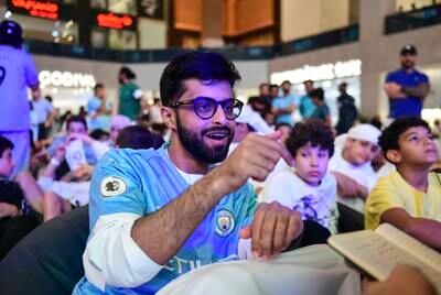 Emirati Mohamed Al Alattas watches the match. Khushnum Bhandari / The National
