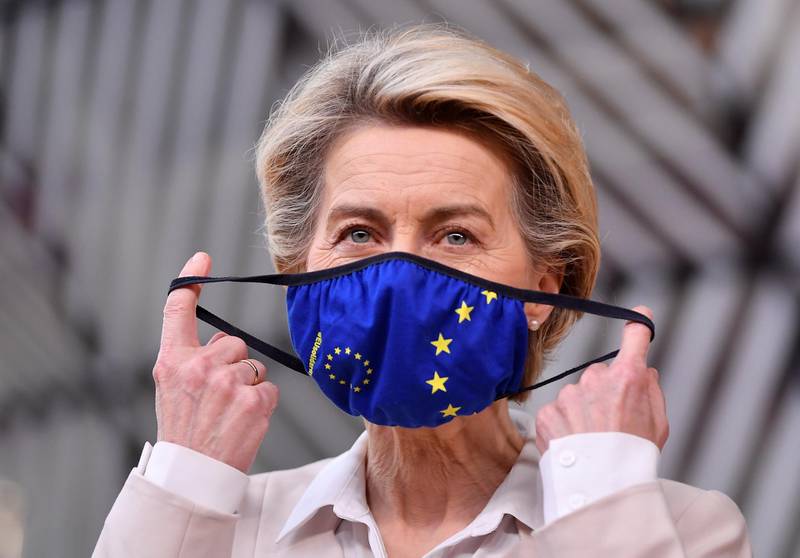 European Commission President Ursula von der Leyen takes off her face mask as she she arrives to attend a face-to-face EU summit amid the coronavirus disease (COVID-19) lockdown in Brussels, Belgium December 10, 2020. John Thys/Pool via REUTERS
