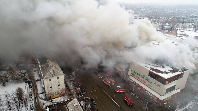 Smoke rises above a multi-story shopping centre in the Siberian city of Kemerovo. Russian Ministry for Emergency Situations photo via AP