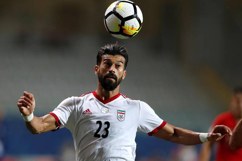 27 Iran ||
The look: Sensible white Adidas strip. Iran has moved on emblazoning 'Iran' on the front of their shirts. They've also dropped the green trim for red. ||
Would I wear it? No.  ||
Photo: Osman Orsal / Reuters