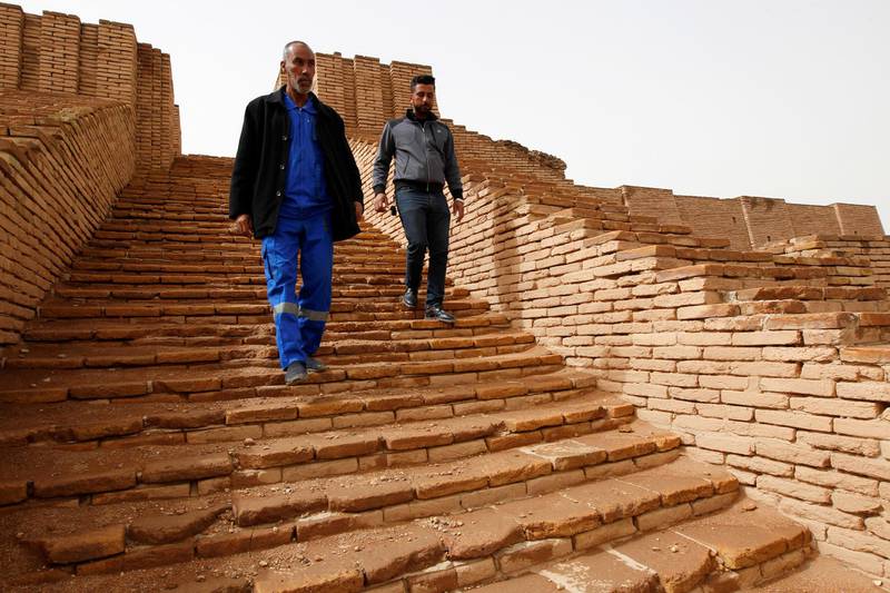 Men walk down the stairs of the Ziggurat of Ur ruins, near Nassiriya, Iraq. Reuters